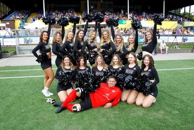 Tim Maelzer surrounded by a cheerleading group at the Kicken mit Herz charity football match for the benefit of the childrens heart ward at Eppendorf University Hospital on 8 September 2024 in Hamburg Kicken mit Herz 2024 charity event in Hamburg