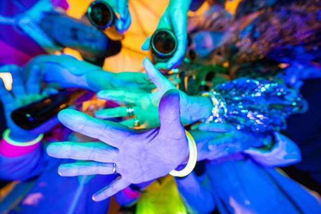 Creative Highlights Symbolfotos A dazzling and vibrant neon party scene filled with hands in dynamic motion and energy A vibrant and colorful display of hands at a lively neonlit party, showcasing immense energy and excitement ,model released, Symbolfoto Copyright: xZoonar.com BjornxBeheydtx 22152465 ,model released, Symbolfoto ,property released
