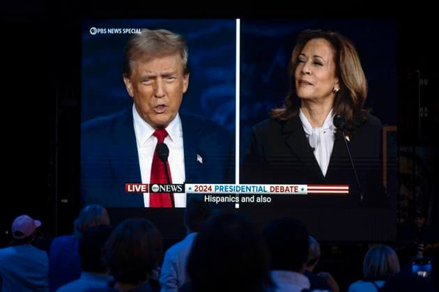 September 10, 2024 - Philadelphia, Pennsylvania, U.S.A. - Former President DONALD TRUMP and Vice President KAMALA HARRIS are seen on a monitor at the Harris-Walz campaign s Presidential Debate Watch Party held at the Cherry Street Pier Philadelphia U.S.A - ZUMAce6_ 20240910_zaf_ce6_015 Copyright: xBrianxCahnx