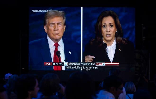 September 10, 2024, Philadelphia, Pennsylvania, USA: Former President DONALD TRUMP and Vice President KAMALA HARRIS are seen on a monitor as guests watch at the Harris-Walz campaign s Presidential Debate Watch Party held at the Cherry Street Pier. Philadelphia USA - ZUMAce6_ 20240910_zaf_ce6_018 Copyright: xBrianxCahnx