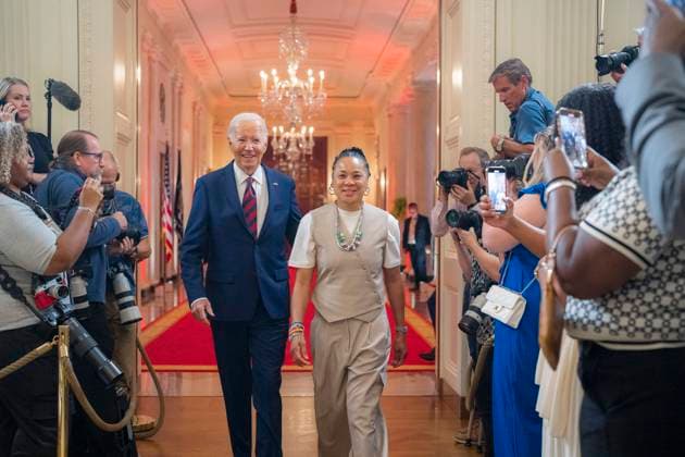 September 10, 2024, Washington, Dc, United States of America: U.S President Joe Biden, left, arrives with the University of South Carolina NCAA WomenÃ¢â‚¬â ¢s basketball champions coach Dawn Staley, right, at East Room of the White House, September 10, 2024 in Washington, D.C. Washington United States of America - ZUMAp138 20240910_zaa_p138_026 Copyright: xOliverxContreras WhitexHousex