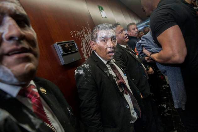 September 10, 2024, Mexico, Mexico: Guards of the Mexican Senate chamber are bathed in foam after protesters break into the building where the judicial reform law was being voted on. The protests that are shaking Mexico are a direct response to the judicial reform proposal presented by President AndrÃ s Manuel Lopez Obrador. This reform, which seeks to modify the structure and functioning of the Judiciary, has generated a wave of criticism and mobilizations from various sectors of society. Especially from workers in the Justice system who say this Reform threatens judicial independence: Critics argue that the reform sought to subject the Judicial Branch to the Executive, weakening the separation of powers and putting the independence of ju - ZUMAs197 20240910_aaa_s197_440 Copyright: xIsraelxFuguemannx