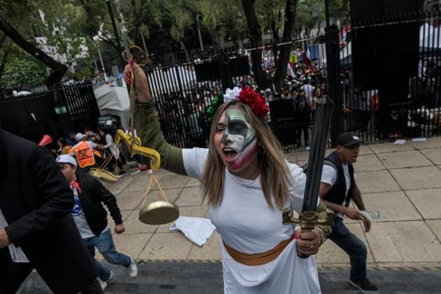 September 10, 2024, Mexico, Mexico: A female protester disguised as justice breaks into the main building of the Senate of Mexico during the demonstration. The protests that are shaking Mexico are a direct response to the judicial reform proposal presented by President AndrÃ s Manuel Lopez Obrador. This reform, which seeks to modify the structure and functioning of the Judiciary, has generated a wave of criticism and mobilizations from various sectors of society. Especially from workers in the Justice system who say this Reform threatens judicial independence: Critics argue that the reform sought to subject the Judicial Branch to the Executive, weakening the separation of powers and putting the independence of judges at risk. Mexico M - ZUMAs197 20240910_aaa_s197_448 Copyright: xIsraelxFuguemannx