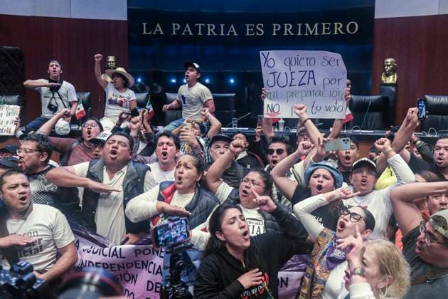 September 10, 2024, Mexico, Mexico: A group of protesters sing the Mexican national anthem after having broken into the Mexican Senate when the country s Judicial Reform was being discussed. The protests that are shaking Mexico are a direct response to the judicial reform proposal presented by President AndrÃ s Manuel Lopez Obrador. This reform, which seeks to modify the structure and functioning of the Judiciary, has generated a wave of criticism and mobilizations from various sectors of society. Especially from workers in the Justice system who say this Reform threatens judicial independence: Critics argue that the reform sought to subject the Judicial Branch to the Executive, weakening the separation of powers and putting the independen - ZUMAs197 20240910_aaa_s197_453 Copyright: xIsraelxFuguemannx