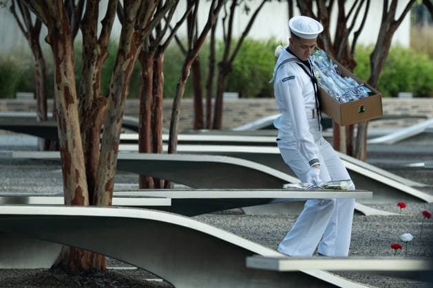 News Themen der Woche KW37 News Bilder des Tages A ceremonial guardsman lays flowers on the memorial benches of the victims of the Pentagon attack on September 11, 2024 to mark 23 years since the 9 11 terrorist attacks in Arlington, Virginia on Wednesday, September 11, 2024.  ARL20240911012 ANNABELLExGORDON