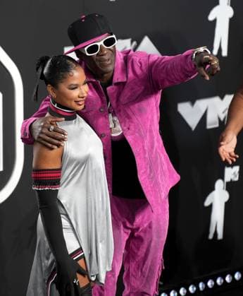 (L-R) Jordan Chiles and Flavor Flav arrive on the red carpet at the 2024 MTV Video Music Awards VMA s at the UBS Arena in Elmont, New York on Wednesday, September 11, 2024.  NYP202409111133 DerekxC.xFrench
