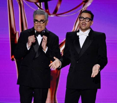(L-R) Hosts Eugene Levy and Dan Levy appear onstage during the 76th annual Primetime Emmy Awards at the Peacock Theater in Los Angeles on Sunday, September 15, 2024.  LAP2024091511 JIMxRUYMEN