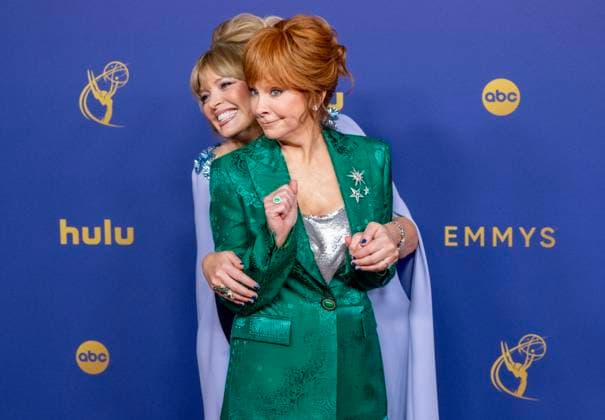 Reba McIntyre (R) and Melissa Peterman arrive for the 76th annual Primetime Emmy Awards at the Peacock Theater in Los Angeles on Sunday, September 15, 2024.  LAP202409150200 ALEXxGALLARDO