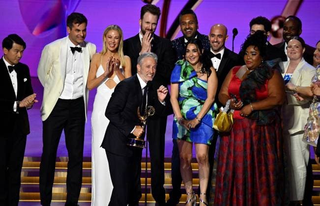 Jon Stewart (C), cast, and crew accept the Outstanding Talk Series award for The Daily Show onstage during the 76th annual Primetime Emmy Awards at the Peacock Theater in Los Angeles on Sunday, September 15, 2024.  LAP2024091577 JIMxRUYMEN