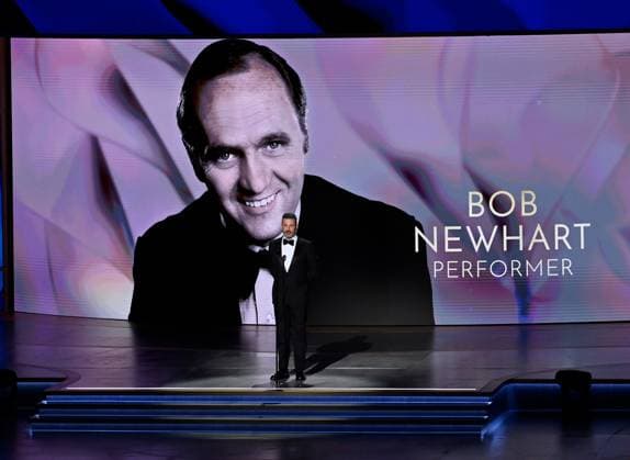 Jimmy Kimmel speaks in front of a portrait of late US actor Bob Newhart onstage during the 76th annual Primetime Emmy Awards at the Peacock Theater in Los Angeles on Sunday, September 15, 2024.  LAP20240915147 JIMxRUYMEN