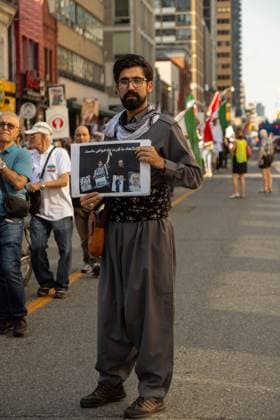 Toronto Second Anniversary Mahsa Amini Death Supporters participate in a protest marking the second anniversary of Mahsa Amini s death in memory of the Iranian victims of the Woman, Life, Freedom Movement in Toronto, Canada, on September 15, 2024. The nationwide protests started in Iran after the death of Mahsa Jina Amini, a 22-year-old girl who died under the custody of the Islamic Republic s Morality Police on September 16th, 2022, in Tehran. Toronto Ontario Canada Copyright: xPouriaxAfkhamix