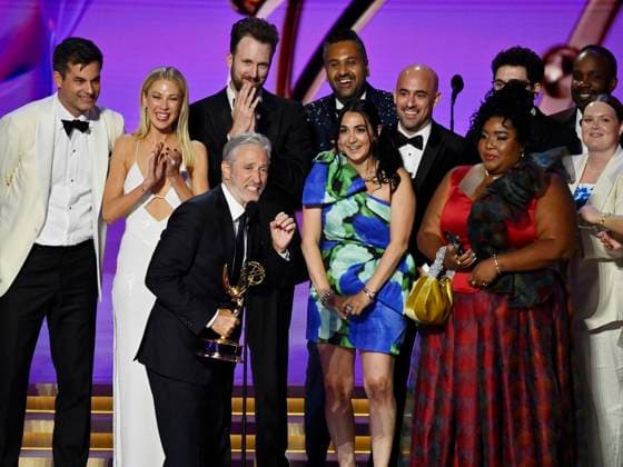Jon Stewart (C), cast, and crew accept the Outstanding Talk Series award for The Daily Show onstage during the 76th annual Primetime Emmy Awards at the Peacock Theater in Los Angeles on Sunday, September 15, 2024.  LAP2024091504023 JIMxRUYMEN
