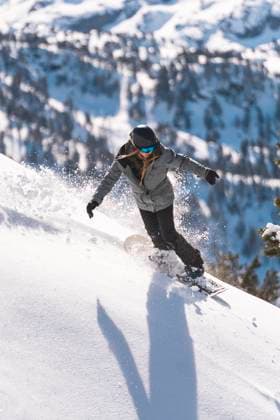 Carefree snowboarder sliding on powder snow model released, Symbolfoto, JAQF01627