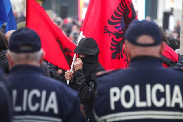 Opposition Protest against government in Tirana A supporter of the opposition centre right Democratic Party holds a party flag making noice during an anti-government rally outside the Parliament in Tirana, Albania, on February 5, 2024. Albanian opposition supporters protested against the government accusing it of corruption. Tirana Albania Copyright: xMatrixxImagesx xArmandoxBabanix 