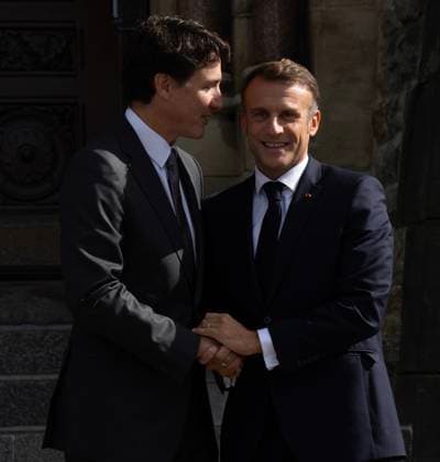 September 26, 2024, Ottawa, On, Canada: Prime Minister Justin Trudeau, left, speaks with French President Emmanuel Macron as they shake hands on his arrival on Parliament Hill, Thursday, September 26, 2024 in Ottawa. Ottawa Canada  - ZUMAc35_ 20240926_zaf_c35_014 Copyright: xAdrianxWyldx