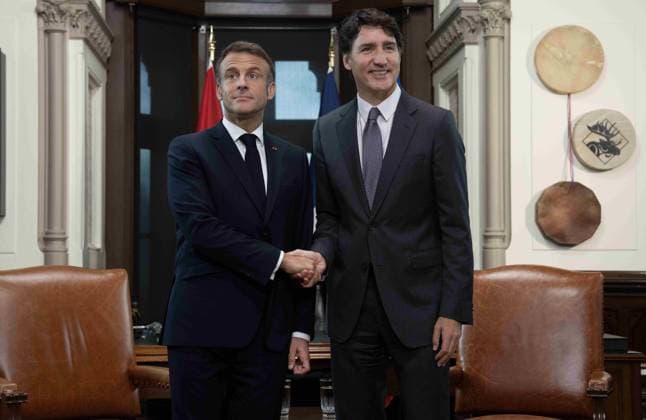 September 26, 2024, Ottawa, On, Canada: Prime Minister Justin Trudeau, right, and French President Emmanuel Macron shake hands before meeting on Parliament Hill, Thursday, September 26, 2024 in Ottawa. Ottawa Canada  - ZUMAc35_ 20240926_zaf_c35_012 Copyright: xAdrianxWyldx