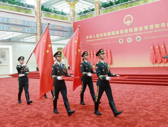 (240929) -- BEIJING, Sept. 29, 2024 -- Guard of honor escorting the national medals and honorary titles enter the venue of the presentation ceremony at the Great Hall of the People in Beijing, capital of China, Sept. 29, 2024. China held a high-profile ceremony on Sunday morning to award the highest state honors ahead of the 75th founding anniversary of the People s Republic of China. ) (FOCUS)CHINA-BEIJING-HIGHEST STATE HONORS-CEREMONY (CN) WangxYe 