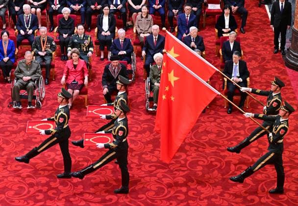(240929) -- BEIJING, Sept. 29, 2024 -- Guard of honor escorting the national medals and honorary titles enter the venue of the presentation ceremony at the Great Hall of the People in Beijing, capital of China, Sept. 29, 2024. China held a high-profile ceremony on Sunday morning to award the highest state honors ahead of the 75th founding anniversary of the People s Republic of China. ) (FOCUS)CHINA-BEIJING-HIGHEST STATE HONORS-CEREMONY (CN) YuexYuewei 