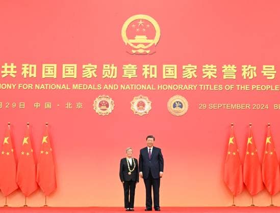 (240929) -- BEIJING, Sept. 29, 2024 -- Chinese President Xi Jinping, also general secretary of the Communist Party of China (CPC) Central Committee and chairman of the Central Military Commission, presents the medal for the title of People s Health Worker to Lu Shengmei in Beijing, capital of China, Sept. 29, 2024. A presentation ceremony for national medals and national honorary titles of the People s Republic of China was held at the Great Hall of the People in Beijing on Sunday. ) CHINA-BEIJING-NATIONAL MEDALS AND HONORARY TITLES-PRESENTATION CEREMONY (CN) XiexHuanchi 
