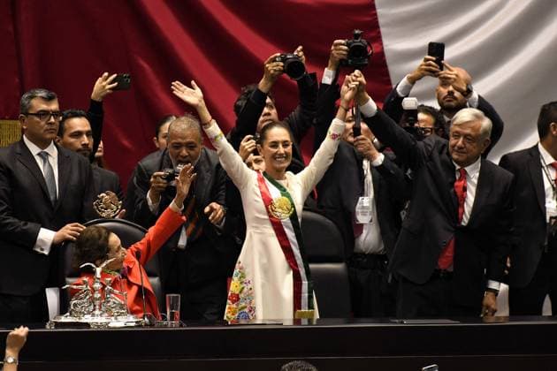 October 1, 2024, Mexico, Mexico, USA: Outgoing president Andres Manuel Lopez Obrador raises the hand of Claudia Sheinbaum after being sworn in as president of Mexico during a ceremony at the Congress of Mexico on Tuesday, October 1, 2024, in Mexico City. She makes history as the first female president of the country. OCTAVIO GOMEZ PINA PI Mexico USA - ZUMAp124 20241001_zaa_p124_004 Copyright: xOctavioxGomezxPinax