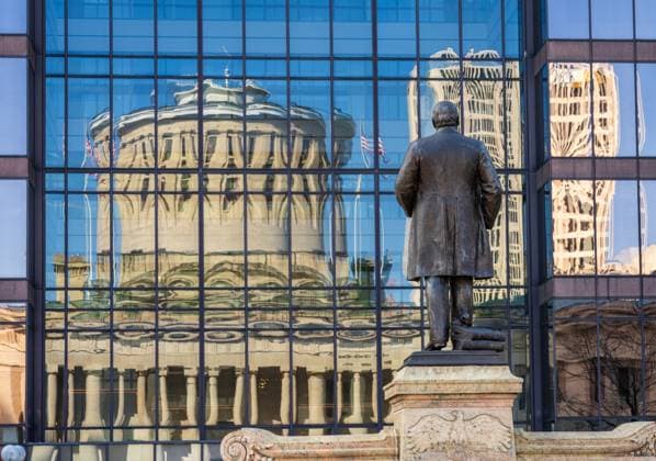 Reflection of McKinley statue and State Capitol building in Columbus McKinley memorial in front of a reflection of the Ohio state Capitol building in the windows of an office building across the street in Columbus, OH Copyright: xZoonar.com StevenxHeapx 21553451
