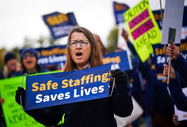October 3, 2024, Regina, Sk, Canada: A person holds a sign while gathering outside of the Saskatchewan Legislative Building during a rally organized by Saskatchewan Union of Nurses in Regina, on Thursday, October 3, 2024. Regina Canada  - ZUMAc35_ 20241003_zaf_c35_086 Copyright: xHeywoodxYux