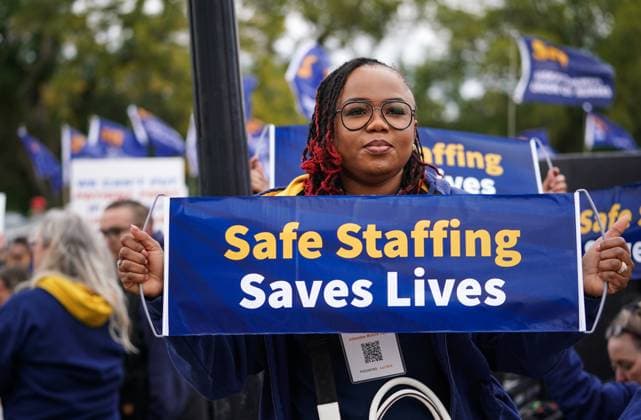 October 3, 2024, Regina, Sk, Canada: A person holds a sign while gathering outside of the Saskatchewan Legislative Building during a rally organized by Saskatchewan Union of Nurses in Regina, on Thursday, October 3, 2024. Regina Canada  - ZUMAc35_ 20241003_zaf_c35_091 Copyright: xHeywoodxYux