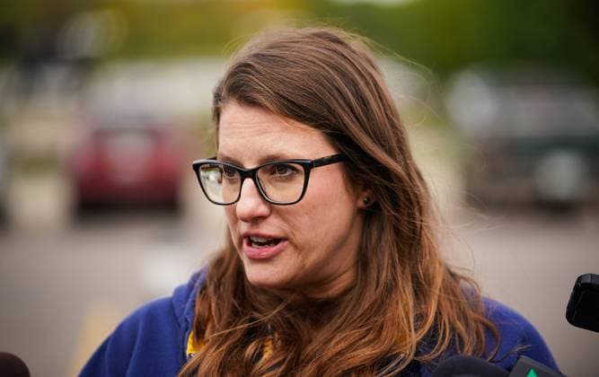October 3, 2024, Regina, Sk, Canada: Stephanie Fehr, an emergency room nurse at St. PaulöÄÃ s Hospital in Saskatoon, speaks to the media after a rally organized by Saskatchewan Union of Nurses in front of the Saskatchewan Legislative Building in Regina, on Thursday, October 3, 2024. Regina Canada  - ZUMAc35_ 20241003_zaf_c35_100 Copyright: xHeywoodxYux