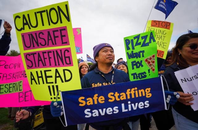 October 3, 2024, Regina, Sk, Canada: People hold signs while gathering outside of the Saskatchewan Legislative Building during a rally organized by Saskatchewan Union of Nurses in Regina, on Thursday, October 3, 2024. Regina Canada  - ZUMAc35_ 20241003_zaf_c35_089 Copyright: xHeywoodxYux