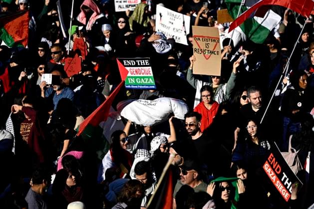 October 5, 2024, Ottawa, On, CAN: A sandbag symbolizing the bodybag of a civilian casualty of Israel s war against Hamas in Gaza is held up as pro-Palestine demonstrators march during a rally in downtown Ottawa, on Saturday, Oct. 5, 2024. Ottawa CAN  - ZUMAc35_ 20241005_zaf_c35_124 Copyright: xJustinxTangx