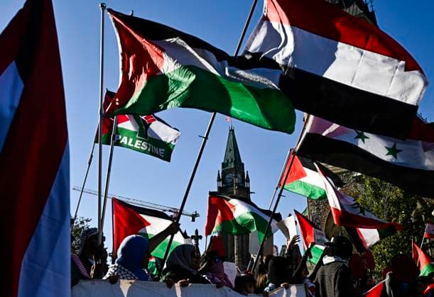 October 5, 2024, Ottawa, On, CAN: The flags of Palestine and other Arab states are waved as pro-Palestine demonstrators march away from Parliament Hill during a rally in Ottawa, on Saturday, Oct. 5, 2024. Ottawa CAN  - ZUMAc35_ 20241005_zaf_c35_125 Copyright: xJustinxTangx
