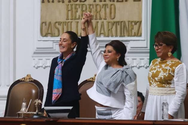 First female MexicoÃ¢â‚¬â ¢s President Claudia Sheinbaum Pardo lifts the hand of incoming Mexico City Head of Government Clara Brugada Molina during the swearing-in ceremony at the Congress of Mexico City. on October 5, 2024 in Mexico City, Mexico. Mexico City Mexico - ZUMAe321 20241005_zia_e321_083 Copyright: xCarlosxSantiagox