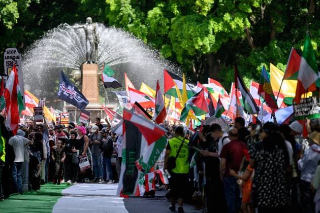 News Themen der Woche KW40 News Bilder des Tages OCT 7 ANNIVERSARY PROTEST SYDNEY, People wave flags during a Pro-Palestine rally in Sydney, Sunday, October 6, 2024. Rallies and vigils across multiple cities over the weekend mark the anniversary of the October 7 attacks in Israel. ( NO ARCHIVING, EDITORIAL USE ONLY, NO USE IN BOOKS WITHOUT CONSENT SYDNEY NSW AUSTRALIA  Copyright: xSTEVENxMARKHAMx 20241006189496085888