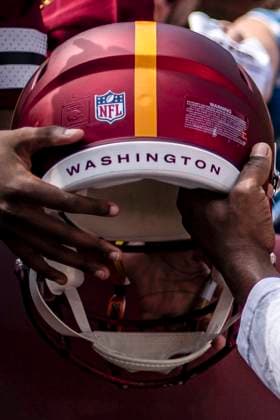 Washington Commanders wide receiver Terry McLaurin (7) signs helmets and t-shirts before a game against the Cleveland Browns at Northwest Stadium in Landover, Maryland on Sunday, October 6, 2024.  WAP20241006425 BONNIExCASH