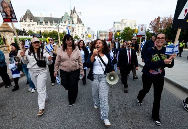 October 6, 2024, Ottawa, On, Canada: Pro-Israel protestors chant as they march towards Parliament Hill from Ottawa City Hall during a ceremony in Ottawa on Sunday, Oct. 6, 2024. Monday marks one-year since the beginning of hostilities between Israel and Palestine. Ottawa Canada  - ZUMAc35_ 20241006_zaf_c35_001 Copyright: xSpencerxColbyx