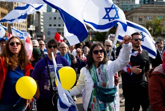 October 6, 2024, Ottawa, On, Canada: A Pro-Israel protestors taking part in a commemorative ceremony yells in anger while giving the thumps down at Liberal MP Mona Fortier (not seen) as she delivers remarks outlining the Liberal government s Israel policy in Ottawa on Sunday, Oct. 6, 2024. Monday marks one-year since the beginning of hostilities between Israel and Palestine. Ottawa Canada  - ZUMAc35_ 20241006_zaf_c35_004 Copyright: xSpencerxColbyx