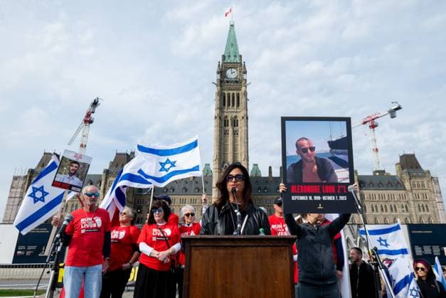 October 6, 2024, Ottawa, On, Canada: Raquel Ohnona, centre, mother of Alexandre Look who died during Oct. 7 attacks speaks during a commemorative ceremony in Ottawa on Sunday, Oct. 6, 2024. Monday marks one-year since the beginning of hostilities between Israel and Palestine. Ottawa Canada  - ZUMAc35_ 20241006_zaf_c35_007 Copyright: xSpencerxColbyx