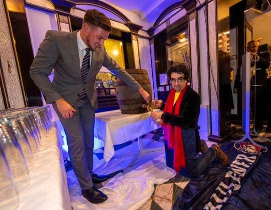 06 10 2024, International Classical Music Festival Festival of Nations 2024, after the concert in the Kurhaus with singer Rolando Villazon Tenor the After Show Party in the Hotel Tanneck Villazon taps an Oktoberfest beer keg for the guests and kneels on the floor in front of the keg 06 10 2024, Classical Music Festival Bad Wörishofen 06 10 2024, Classical Music Festival Ba