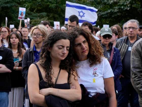 October 7, 2024, Montreal, Pq, CANADA: Attendees embrace during a pro-Israel vigil on the anniversary of a Hamas attack on Israel that triggered the ongoing war in Gaza in front of McGill University, in Montreal, Monday, Oct. 7, 2024. Montreal CANADA  - ZUMAc35_ 20241007_zaf_c35_004 Copyright: xRyanxRemiorzx