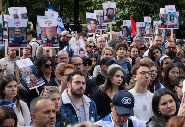 October 7, 2024, Montreal, Pq, Canada: People hold pictures of hostages as they attend a pro-Israel vigil on the anniversary of a Hamas attack on Israel that triggered the ongoing war in Gaza in front of McGill University, in Montreal, Monday, Oct. 7, 2024. Montreal Canada  - ZUMAc35_ 20241007_zaf_c35_029 Copyright: xRyanxRemiorzx