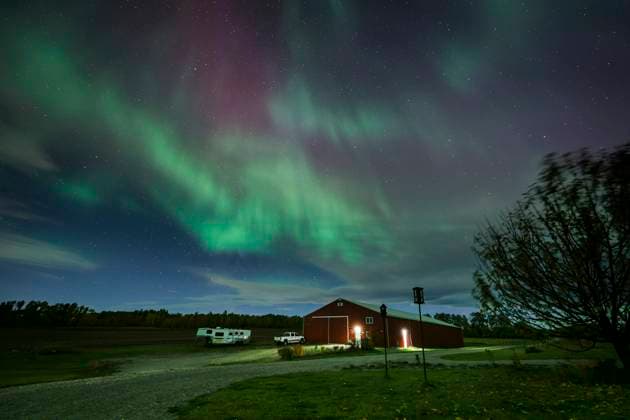 October 7, 2024, Calgary, Ab, CANADA: The northern lights (aurora borealis) make an appearance over a home near Cremona, Alta., Monday, Oct. 7, 2024. Auroras are the result of disturbances in the Earth s magnetosphere caused by the solar wind. Calgary CANADA  - ZUMAc35_ 20241007_zaf_c35_117 Copyright: xJeffxMcintoshx
