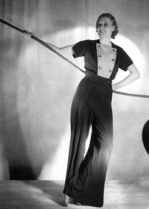 Orig. caption... DECK WEAR FOR THIS SEASON S CRUISES. 14.3.33. The most popular holiday for this summer is sea cruising, and many delightful models have been designed for wear on deck and for land trips. This delightful model shows one of the newest deck suits carried out in light royal blue wool, featuring wide trousers which are worn over a bathing costume. The separate coat has a vest of scarlet white stripes and is finished with chromium buttons. Note Chest Patch Pants Buttons Models Posing Striped Rope Stripes CD666 sites: UK sp_sw x5600x *** Orig caption DECK WEAR FOR THIS SEASON S CRUISES 14 3 33 The most popular holiday for this summer is sea cruising, and many delightful models have been designed for wear on deck and for land tri  Copyright: xx NAVY FASHION