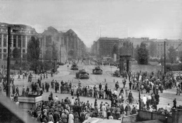 Orig. caption... RUSSIANS DECLARE MARTIAL LAW IN BERLIN S EAST ZONE. 17.6.53. PHOTO SHOWS. Russian tanks patrol the streets of the East Zone of Berlin, watched by a crowd of East Berliners, after the Russians had declared martial law in East Berlin after 100,000 Germans had rioted, tearing down the Red Flag and paraded through the streets shouting We Want to ask Free. Orig. caption... AFTER THE REVOLT IN EAST BERLIN. Russian tanks patrol the streets after the uprising was quelled. Note The popular uprising in East Germany on June 17, 1953 started as a protest against a government decision to increase working hours. See also BAJ668 and BAJ679-BAJ680 Image series Photo report Riots Unrest Political opposition State of emergency CD614 sites: E  Copyright: xx Uprising in East Berlin