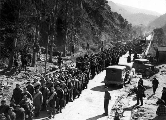 Orig. caption... INTERNATIONAL BRIGADE CROSSES INTO FRANCE. 3,000 men of the International Brigade consisting of Poles, Germans and Czechs who have been fighting in Catalonia, marching across the mountain road to the border town of Le Perthus. Lorries loaded with retreating troops of the Government block the roads. Note Spanish Civil War - armed conflict between right-wing and left-wing forces in Spain 1936-39. The war began with a revolt against the incumbent Popular Front government. The right-wing forces (rebels), the Falange, with its leader General Franco, were supported by Italy and Germany. The government was supported by the left and volunteers from abroad in the International Brigade. Image archive catalog no. 50.10 sites: FRANCE;  Copyright: xXxXxXx INTERNATIONAL BRIGADE