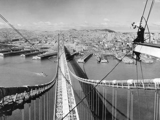 Orig. caption... AUTOS WILL SOON ROLL OVER FRISCO BAY and here s the way automobiles will be entering San Francisco, after Nov. 12, 1936, when the San Francisco-Oakland Bay Bridge, world s largest span, will open to traffic. The view, taken from the suspension tower, shows paving forms laid in the center lane, and floor steel in place for the upper deck which will carry six lanes of automobile traffic. The lower deck will accommodate two interurban train tracks, and three lanes for trucks. The San Francisco waterfront, over which the bridge passes is in the foreground, with the business section to the right. Twin Peaks to the rear, and in the distance, the Golden Gate. The bridge will be eight and one-quarter miles long, and cost $77,200,0  Copyright: xx SAN FRANCISCO-OAKLAND BAY BRIDGE