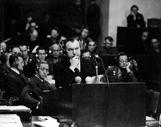 Orig. caption... MIRACLE OF NUREMBERG. IN ACCUSE! Justice Robert Jackson of the Supreme Court of the United States is chief American prosecutor of war criminals at Nuremberg. He was the star of the prosecution and is shown here as he made his damning indictment of the Nazi hierarchy. In front of him are the microphone and the lights that warn him if he is speaking too fast for the translators. Note Prosecutor Headphones Nuremberg Trials persons: Robert Jackson sites: NÜRNBERG ;GERMANY ;USA* sp_sw x5600x *** Orig caption MIRACLE OF NUREMBERG IN ACCUSE Justice Robert Jackson of the Supreme Court of the United States is chief American prosecutor of war criminals at Nuremberg He was the star of the prosecution and is shown here as he made hi  Copyright: xXxXxXx THE NUREMBERG PROCESS