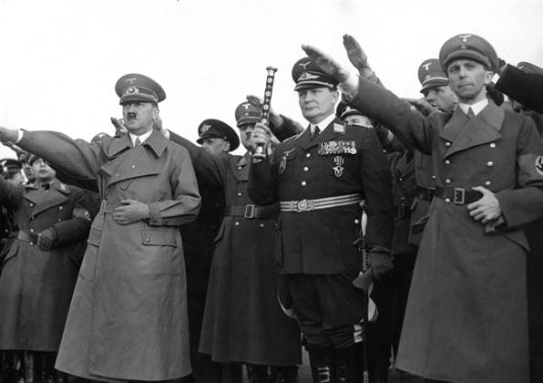 Orig. caption... TRIUMPH FAHRT DURCH DAS SPALIER DER MILLIONEN. Die Reichshauptstadt Berlin empfing on Wednesday evening the Führer der geinten deutschen Nation with einer überwältigenden Begeisterung. Millionen Volksgenossen säumten den Weg, den der Führer nahm, um ihn mit ihren Jubelrufen zu begrüssen. U.B.z. the Führer mit Generalfeldmarschall Göring und Reichminister Dr. Goebbels nach dem Empfang auf dem Flughafen während des Gens der nationalen Lieder. 16.3.38. Note Swastika Hitler Salute Iron Cross Nazi Salute CD698 persons: ADOLF HITLER;HERMANN GÖRING;JOSEPH GOEBBELS sites: BERLIN;GERMANY sp_sw x5600x *** Orig caption TRIUMPH RIDES THROUGH THE SPALIER OF MILLIONS The Reich capital Berlin received on Wednesday evening the  Copyright: xx HITLER, GÖRING AND THE GOEBBELS