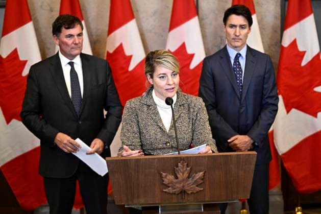October 14, 2024, Ottawa, On, CAN: Minister of Foreign Affairs Melanie Joly, centre, Prime Minister Justin Trudeau, right, and Minister of Public Safety, Democratic Institutions and Intergovernmental Affairs Dominic LeBlanc participate in a news conference on the investigative efforts related to violent criminal activity occurring in Canada with connections to India, on Parliament Hill in Ottawa, on Monday, Oct. 14, 2024. Ottawa CAN  - ZUMAc35_ 20241014_zaf_c35_050 Copyright: xJustinxTangx