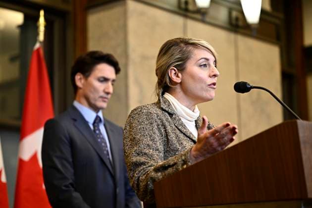 October 14, 2024, Ottawa, On, CAN: Minister of Foreign Affairs Melanie Joly speaks as Prime Minister Justin Trudeau listens during a news conference on the investigative efforts related to violent criminal activity occurring in Canada with connections to India, on Parliament Hill in Ottawa, on Monday, Oct. 14, 2024. Ottawa CAN  - ZUMAc35_ 20241014_zaf_c35_052 Copyright: xJustinxTangx