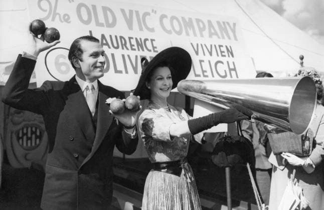 Orig. caption...ROLL BOWL OR PITCH Armed with megaphone, VIVIEN LEIGH attracts custom to the Aunt Sally sideshow at the Theatrical Garden Party today (Tuesday), while SIR LAURENCE OLIVIER holds the missiles aloft. Held at the Roshampton Club, in aid of the Actors Orphanage, the garden party was attended by scores of stage, screen and radio stars. Members of the general public, of course, were particularly interested in the fashions. Orig. caption... LAURENCE OLIVIER AND HIS WIFE VIVIEN LEIGH AT THE THEATER PARTY. Note Olivier, Sir Laurence, 1907-89, British actor, director and theater manager Leigh, Vivien, eg. Vivian Hartley, 1913-67, British actress Megaphones Balls Charity CD133 persons: LAURENCE OLIVIER;VIVIEN LEIGH sites: USA*;UK sp  Copyright: xXxXxXx OLIVIER AND LEIGH